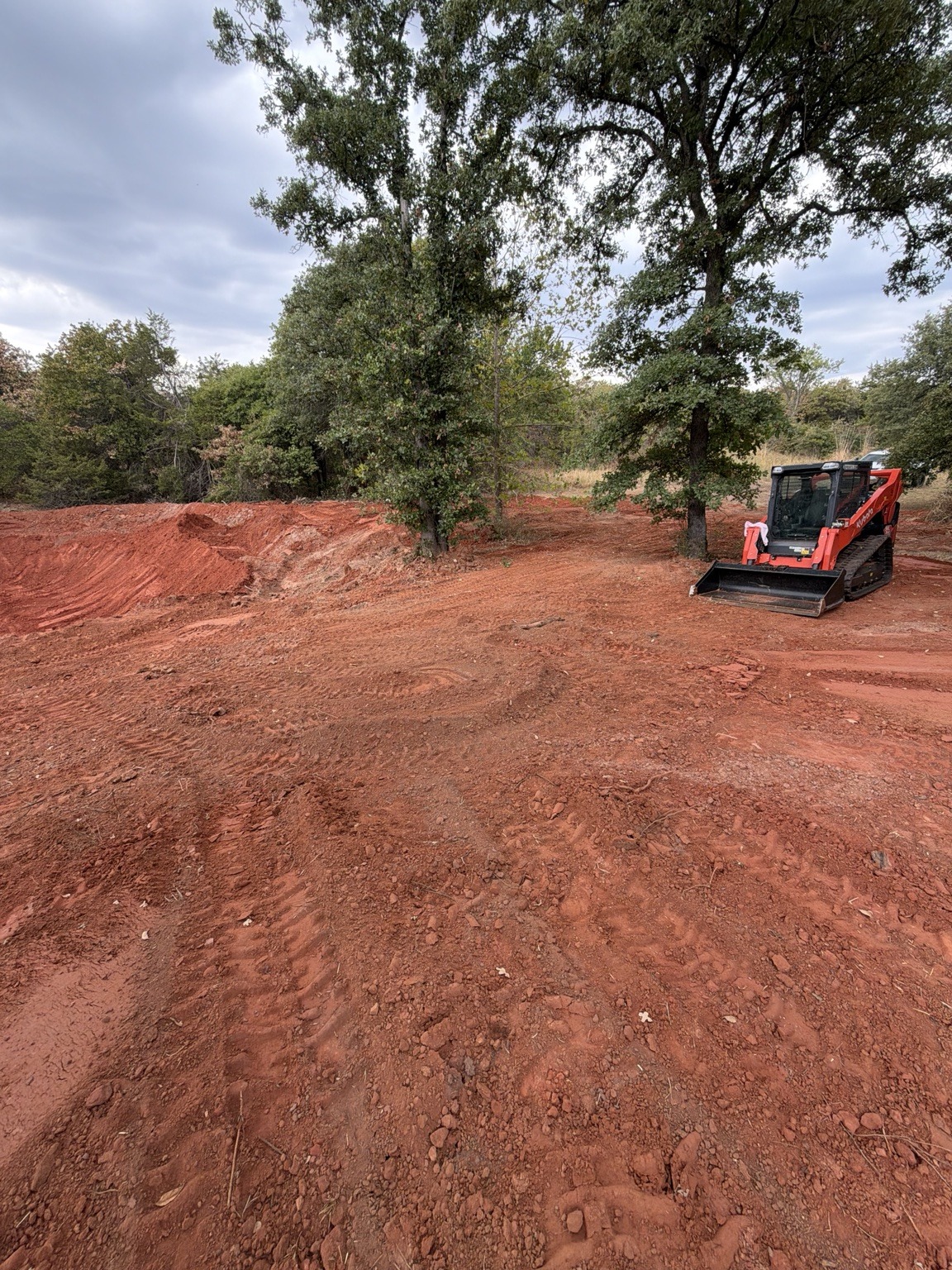 Sullivan Earthworks skid steer and grading work on red clay in Central Oklahoma